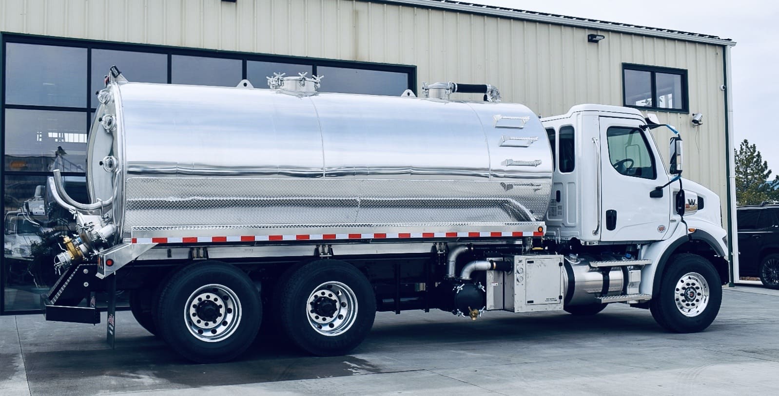 Vacuum tanker truck parked at a service yard
