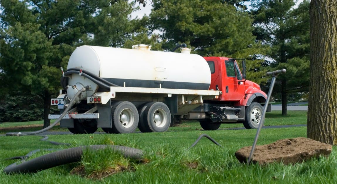 service truck pumping in front yard